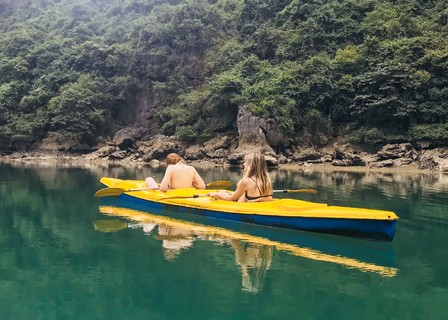 Halong Bay – Hanoi: Join the Tai Chi class, admire the sunrise, and go kayaking or swimming in the Ao Ech region. (B, L)